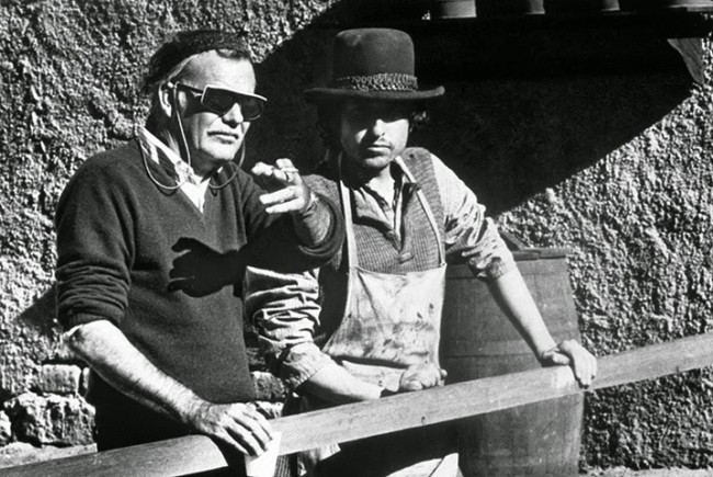 Peckinpah at work with Bob Dylan who also composed the score to 'Pat Garrett & Billy the Kid'.